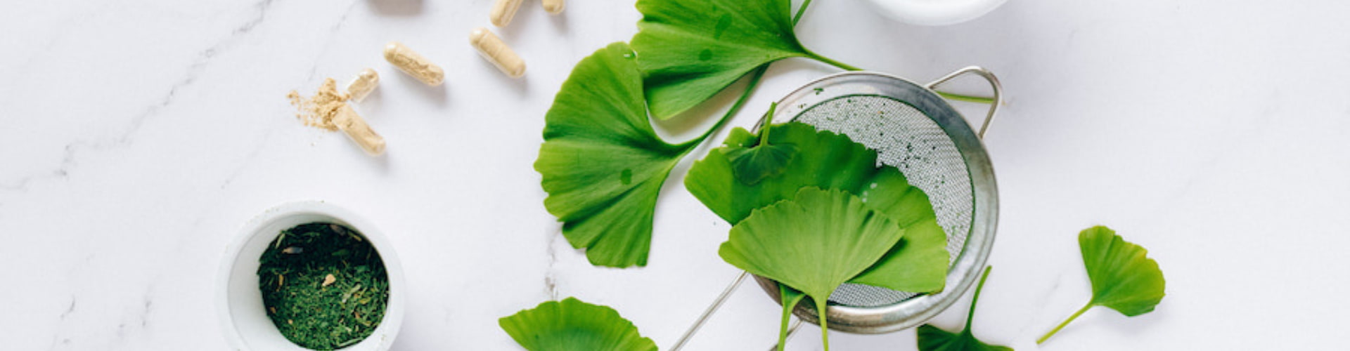 Herbal botanicals on top of a strainer