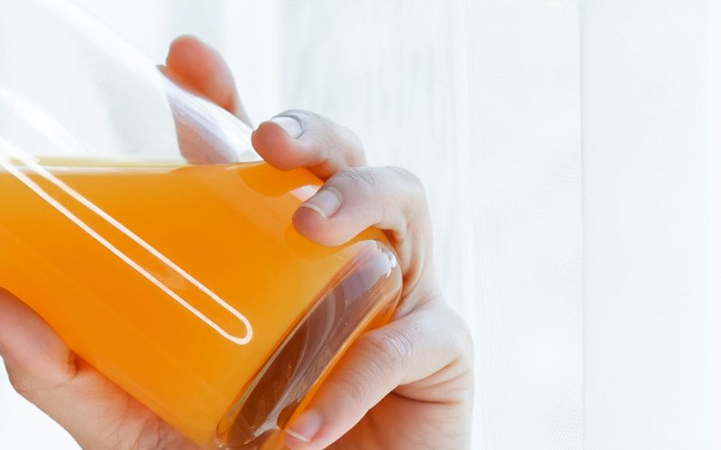 Drinking Kratom mixed with orange juice.