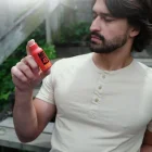Man holding Boost bottle